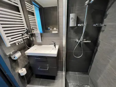 a bathroom with a sink and a shower at Best Western Hotel Royal Centre in Brussels