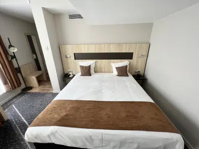 a bedroom with a large bed in a room at Best Western Hotel Royal Centre in Brussels