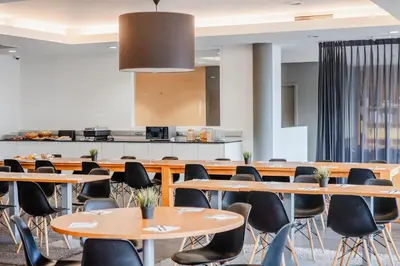 a conference room with tables and chairs at Hotel Corsendonk Viane in Turnhout