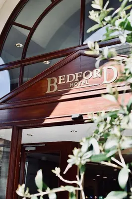 a sign on the door of a hotel at Bedford Hotel Brussels in Brussels