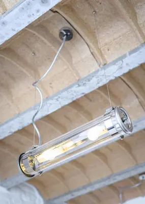 a light fixture hanging from a ceiling at Hotel La Grande Cloche in Brussels
