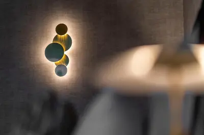 a pair of lights hanging from a wall at Van der Valk Waterloo in Waterloo