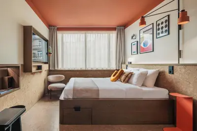 a hotel room with a bed and a window at The Usual Brussels in Brussels