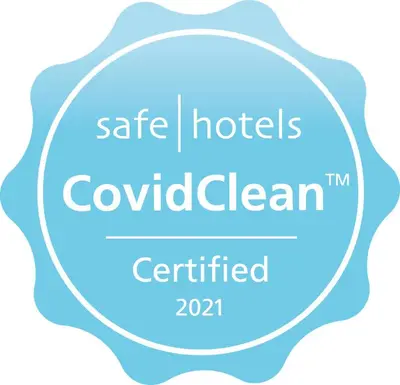 a logo for safe hotels in colombia in a circle at Martin's Manoir in Genval