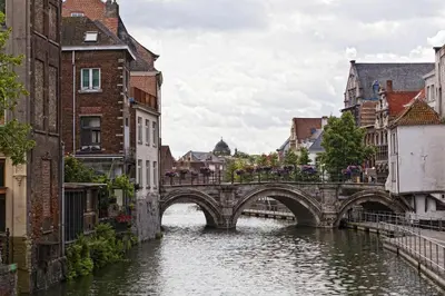a bridge over a river in a city at NH Mechelen in Mechelen