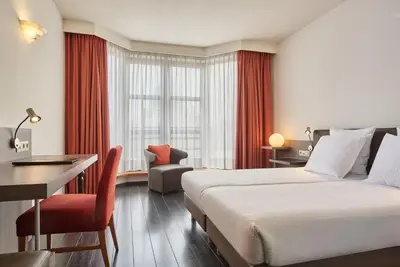 a hotel room with a bed and a desk at Theater Hotel in Antwerp