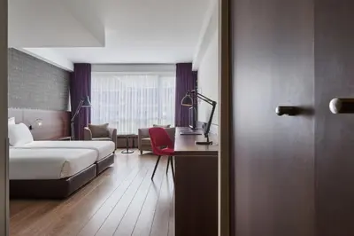 a hotel room with a bed and a desk at Theater Hotel in Antwerp