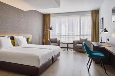 a hotel room with a bed and a desk and chair at Theater Hotel in Antwerp