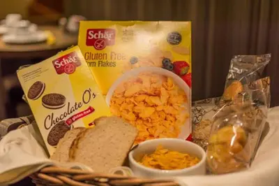 a basket of food with a sandwich and a box of cereal at De Keyser Hotel in Antwerp