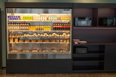 a refrigerator filled with lots of food and drinks at Thon Hotel Brussels Airport in Diegem