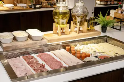 a buffet with meats and cheese and other foods at Thon Hotel Brussels City Centre in Brussels
