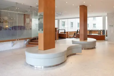 a lobby with two columns in a building at Holiday Inn Gent Expo by IHG in Ghent