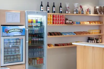 a refrigerator filled with lots of drinks in a store at Holiday Inn Gent Expo by IHG in Ghent