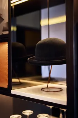 a hat sitting on top of a shelf at Cardo Brussels, Autograph Collection in Brussels