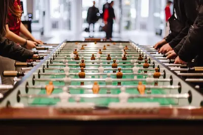 a group of people playing a board game at Holiday Inn Hotel Brussels Airport by IHG in Diegem