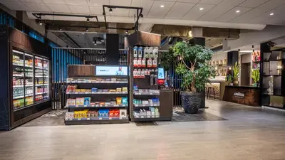 a grocery store aisle with products on display at Holiday Inn Hotel Brussels Airport by IHG in Diegem