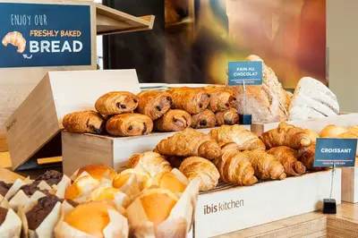 a bakery with different types of bread on display at ibis Gent Centrum St. Baafs Kathedraal in Ghent