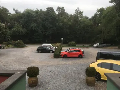 a group of cars parked in a parking lot at Hotel Fauwater in Kasterlee