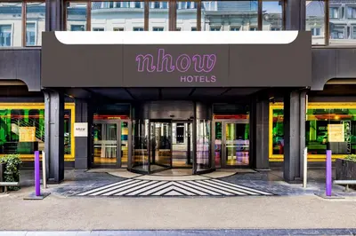 an entrance to a building with revolving doors at nhow Brussels Bloom in Brussels