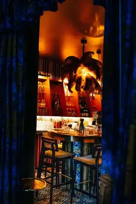 a bar with chairs and a table in a room at Hotel Groenendaal in Hoeilaart
