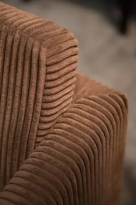 a close up of the arm of a brown couch at Hotel The Neufchatel in Brussels