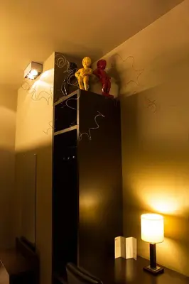a room with a mirror and a table with a lamp at Hotel The Neufchatel in Brussels