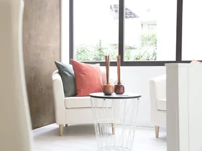 a living room with a couch and a table at B&B Be In Brussels in Brussels
