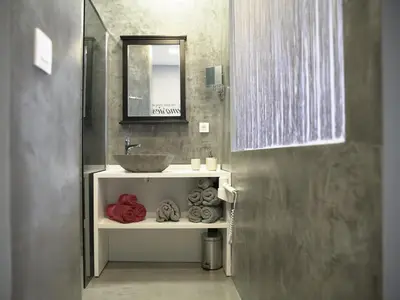 a bathroom with a sink and a mirror at B&B Be In Brussels in Brussels