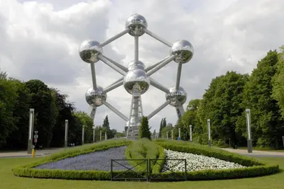 a largeolith in a park with flowers and trees at Hotel Expo in Brussels
