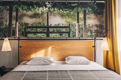 a bedroom with a bed with two pillows on it at Zoom Hotel in Brussels