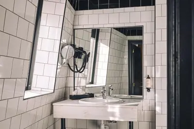 a bathroom with a sink and a mirror at Zoom Hotel in Brussels