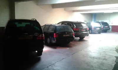 a group of cars parked in a parking garage at Hotel Prince de Liege in Brussels