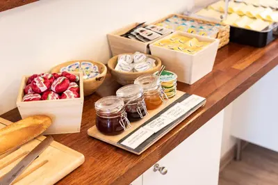 a counter with different types of food on it at Beverly Hills Hotel in Brussels
