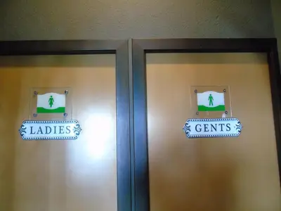 two doors with a sign that reads ladders and crimes at DC Sleep & Go Brussels West in Brussels