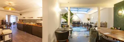 a large kitchen and dining room with tables and chairs at Hotel The Shepherd in Leuven