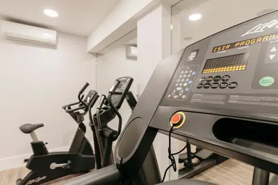 a gym with two treadmills and a treadmill at Catalonia Brussels in Brussels
