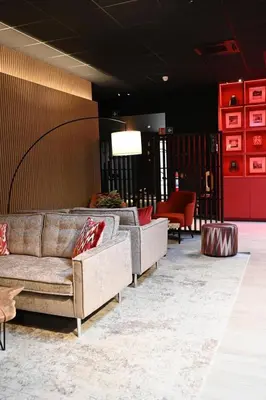 a lobby with couches and chairs in a room at Bremberg Hotel in Haasrode