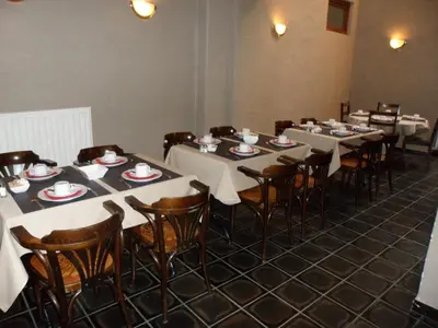 a row of tables and chairs in a room at Hotel De Franse Kroon in Diest