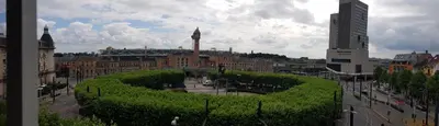 a view of a city with a large building at Hotel Castel in Ghent