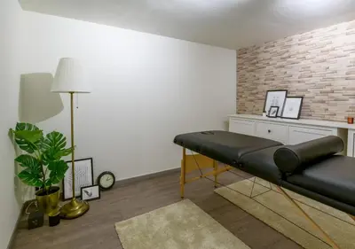 a living room with a bench and a brick wall at Axis Hotel in Kortenberg