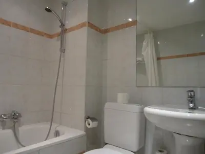 a bathroom with a toilet and a sink and a shower at Résidence-Hotel Le Quinze Grand Place Brussels in Brussels