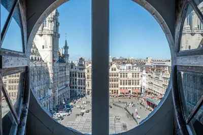 a view of a city from a window at Résidence-Hotel Le Quinze Grand Place Brussels in Brussels