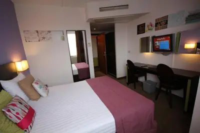 a hotel room with a bed and a desk at Hotel Floris Arlequin Grand-Place in Brussels