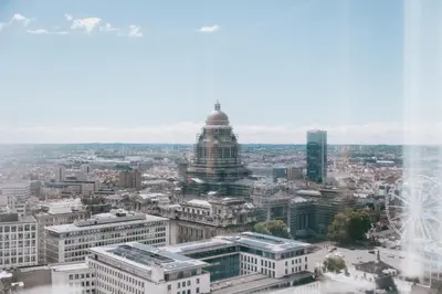 an aerial view of a city with a tall building at The Hotel Brussels in Brussels