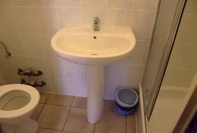 a bathroom with a sink and a toilet at Condo Gardens Antwerp in Antwerp
