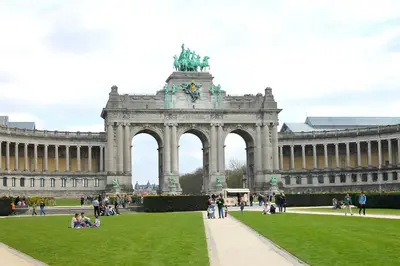 a large building with a statue in front of it at Condo Gardens Brussels in Brussels