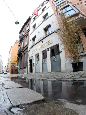 a building with a sun hotel on the side of a street at Sun Hotel in Brussels