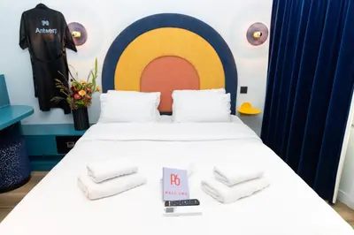 a room with a bed with towels on it at P6 Antwerp in Antwerp
