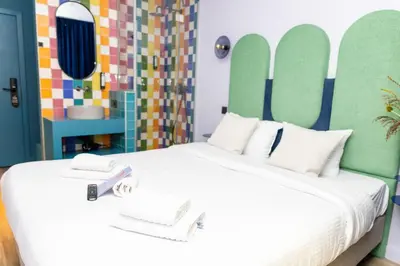 a bedroom with a large bed with two white pillows at P6 Antwerp in Antwerp