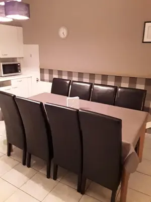 a dining room table with black chairs in a kitchen at Wenceslas Cobergher III in Bertem